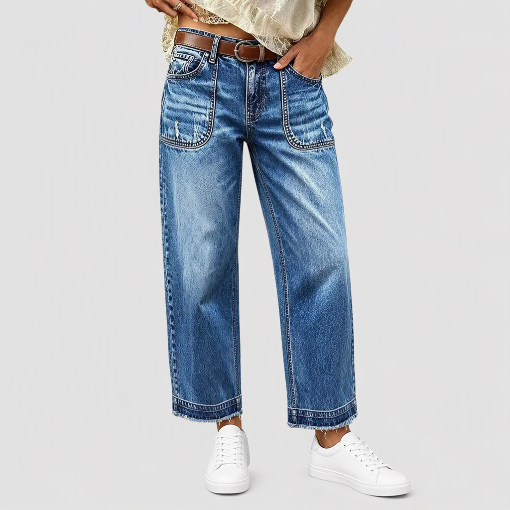 Jeans en denim vintage stretch pour femme, jambe droite, avec poches plaquées usées et ourlet effiloché brut