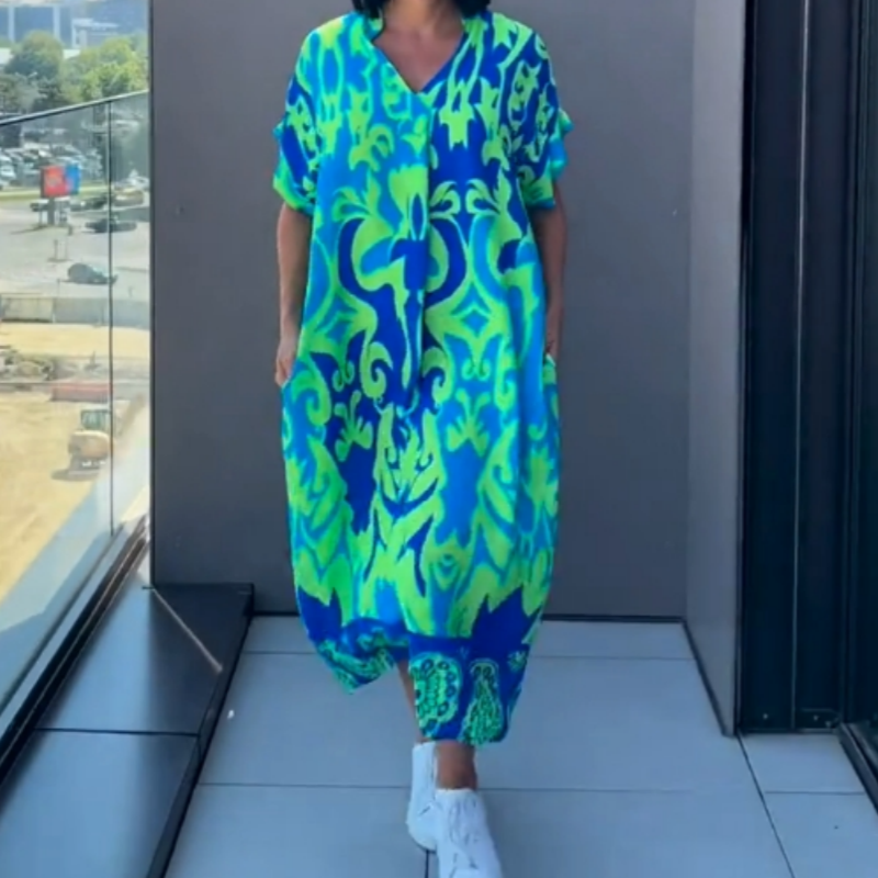 👗 50% DE RÉDUCTION ! 🌸 Robe décontractée élégante à imprimé et encolure V pour femmes – Tissu fluide, coupe flatteuse et parfaite pour le printemps ☀️