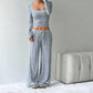 Ensemble haut ajusté en maille rayée et pantalon large