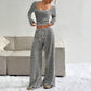 Ensemble haut ajusté en maille rayée et pantalon large