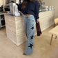 Pantalon en denim à jambes larges avec patch étoilé en strass