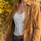 Veste en faux daim à pompons pour femme