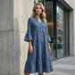 Robe midi évasée en tissu texturé uni