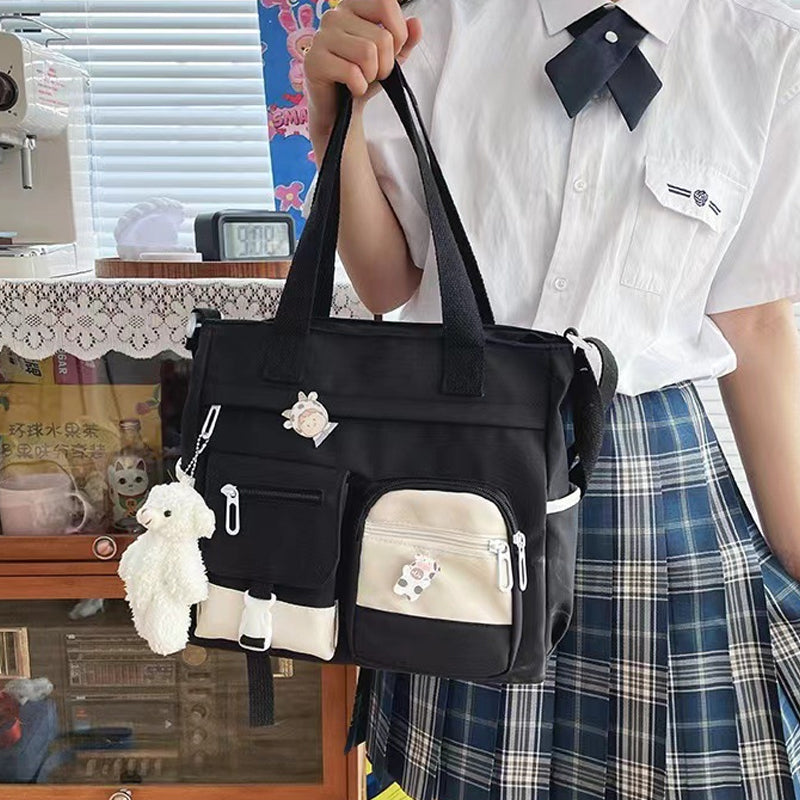 Joli sac à bandoulière pour adolescentes avec 2 écussons