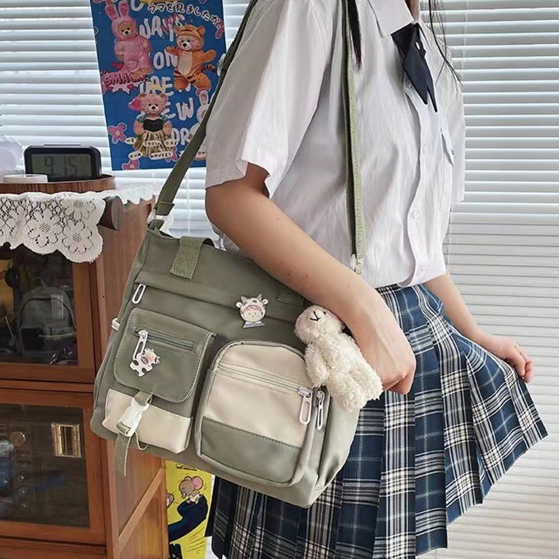 Joli sac à bandoulière pour adolescentes avec 2 écussons