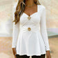 Haut femme à col en V et coupe peplum avec motifs de fleurs