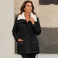 Veste matelassée à capuche mi-longue pour femme