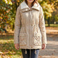 Veste matelassée à capuche mi-longue pour femme